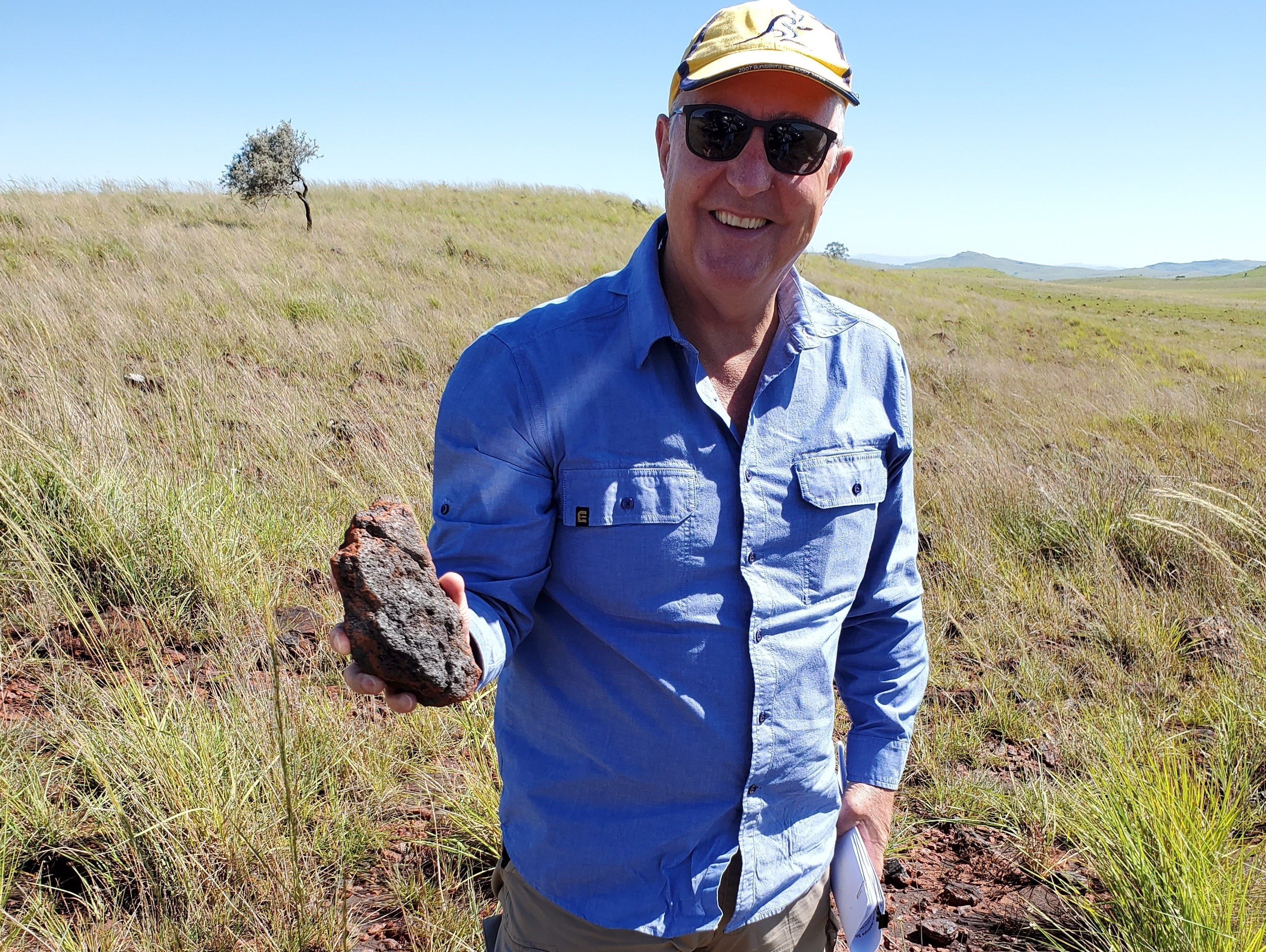 CEO Paul Bobby Holding a High Grade Iron Ore